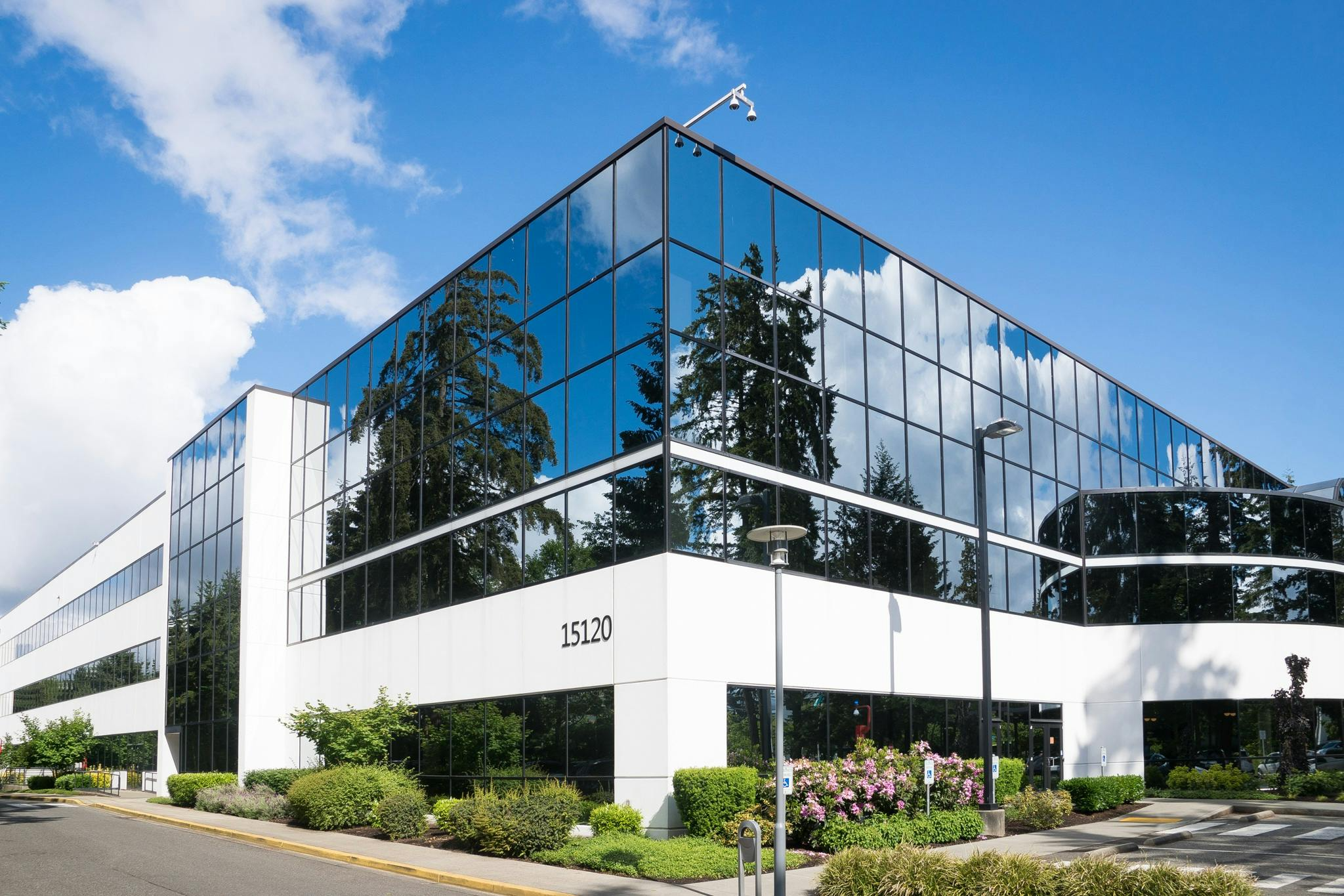 corner view of an office building with glass windows all around